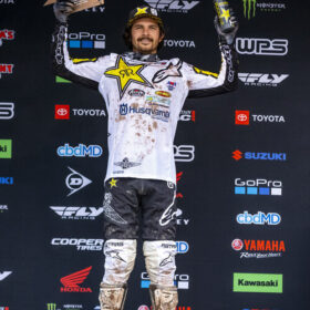 Jason Anderson holding third place trophy at the 2020 Salt Lake City 3 Supercross Race